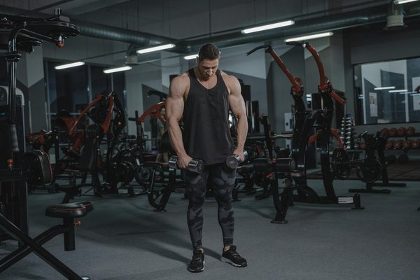 What steps should coaches take to foster team spirit among diverse football squads in the UK?